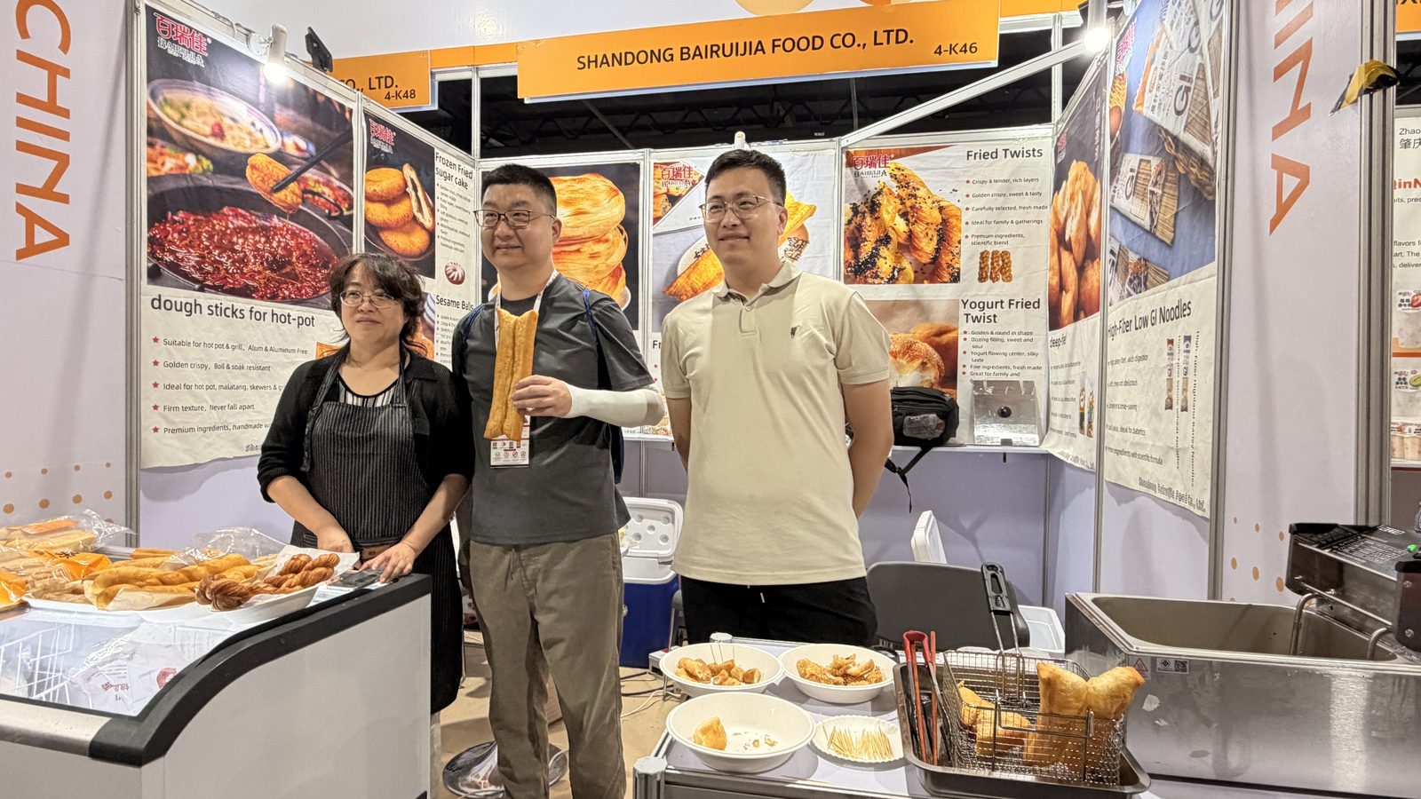 J-Origin team at a China food supplier booth, THAIFEX-Anuga Asia 2026 Bangkok